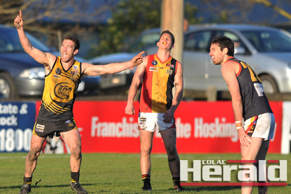 Colac Tiger Andrew Kelly, left, celebrates one of his two goals in a best-on-ground performance.